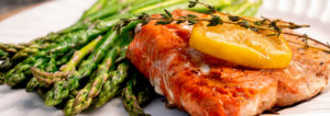 Photo of Salmon Filet with Lemon Slices Plated With Asparagus